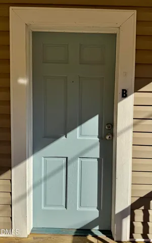 a close view of a utility room with washer and dryer