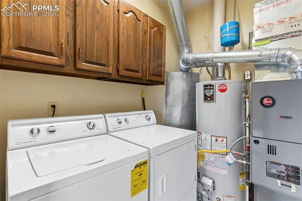 a view of a white house with many windows