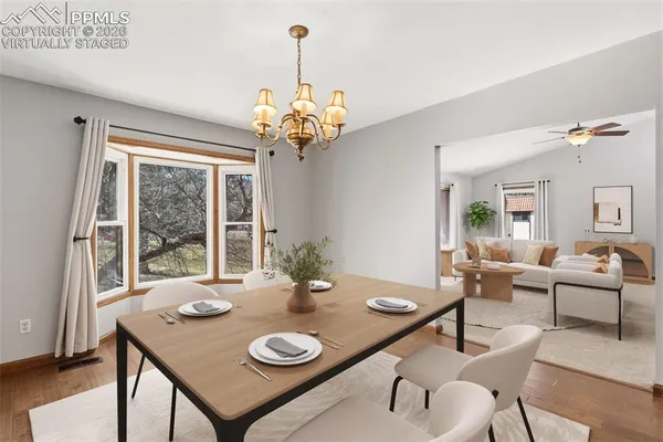 a view of a dining room with furniture window and outside view