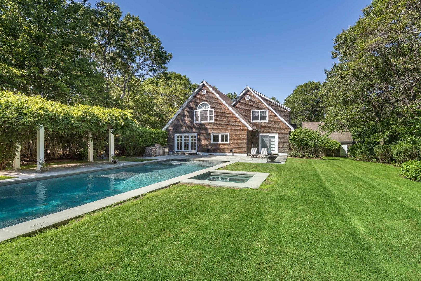 17 Long Hill Road East Hampton, NY 11937 - Photo 2 of 10 a front view of house with yard and green space