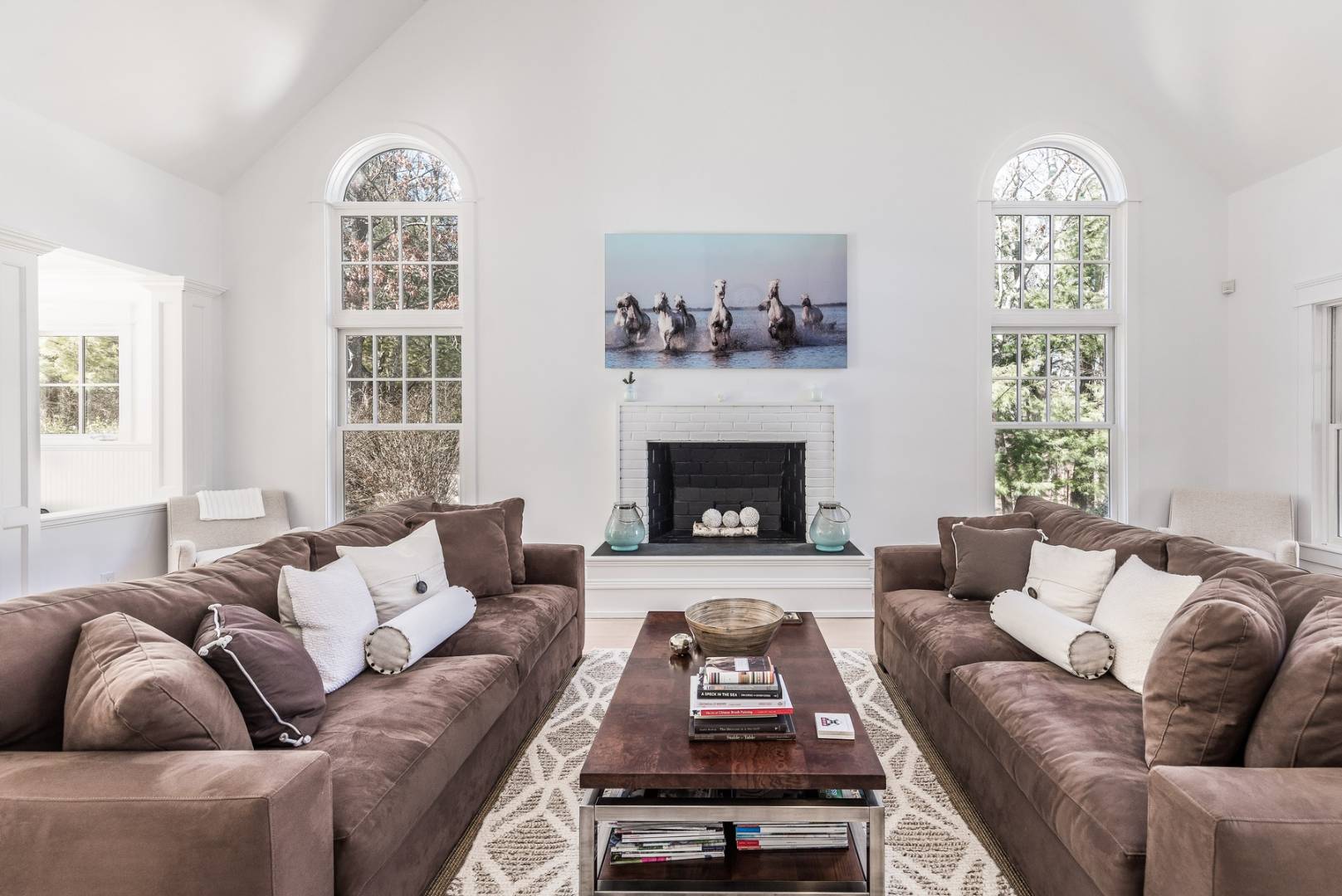 17 Long Hill Road East Hampton, NY 11937 - Photo 3 of 10 a living room with furniture and a fireplace