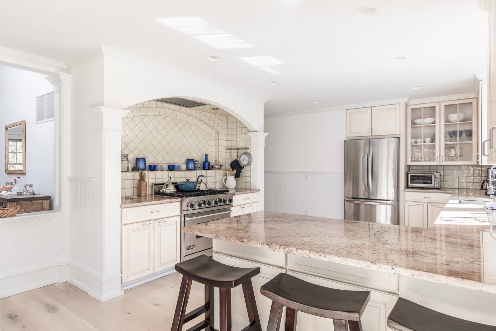 17 Long Hill Road East Hampton, NY 11937 - Photo 4 of 10 a kitchen with stainless steel appliances kitchen island granite countertop a refrigerator and stove