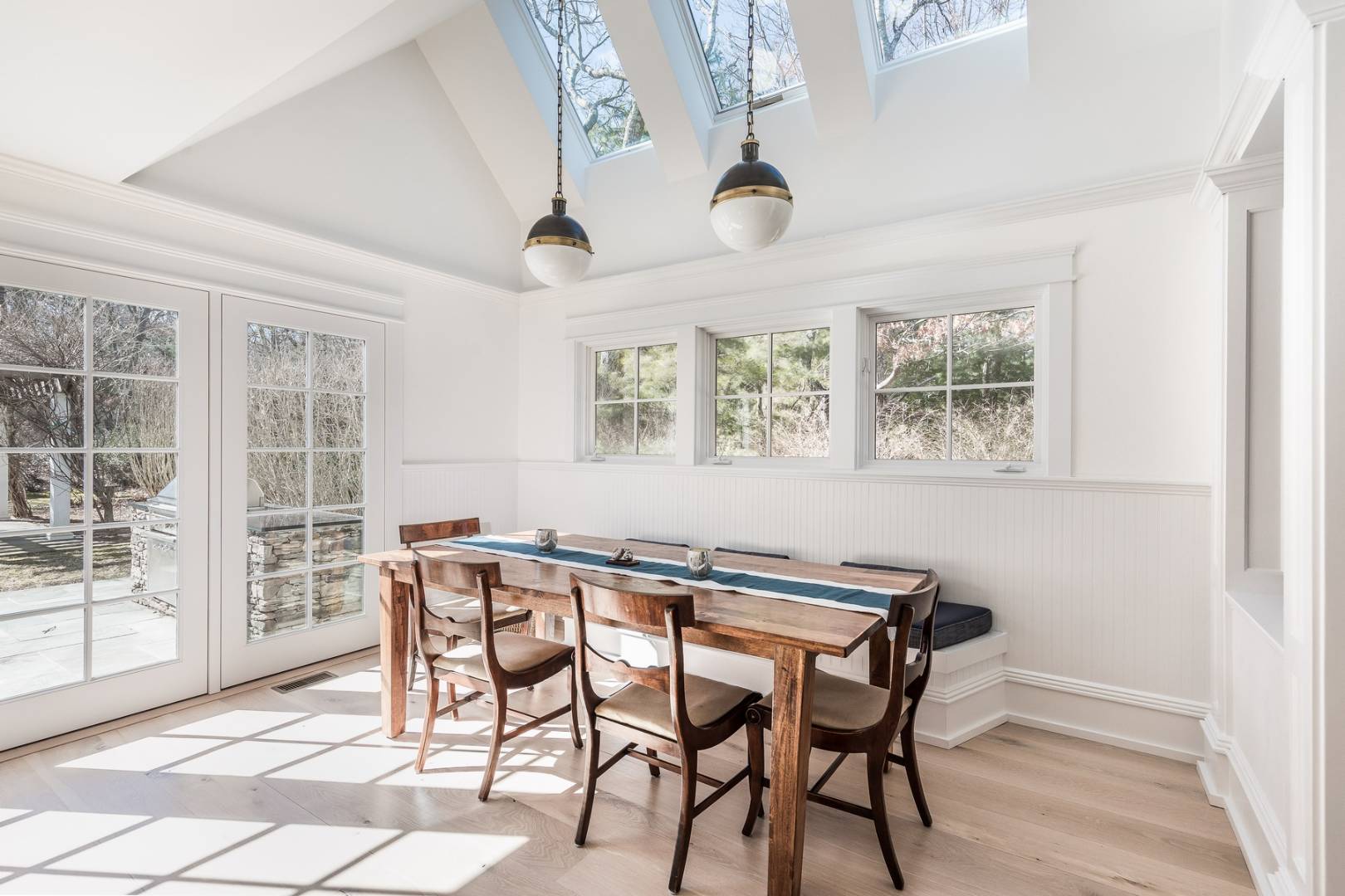 17 Long Hill Road East Hampton, NY 11937 - Photo 5 of 10 a view of a dining room with furniture and wooden floor