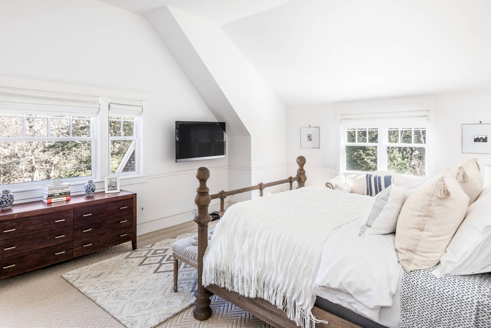 17 Long Hill Road East Hampton, NY 11937 - Photo 7 of 10 a bedroom with a bed and a flat screen tv