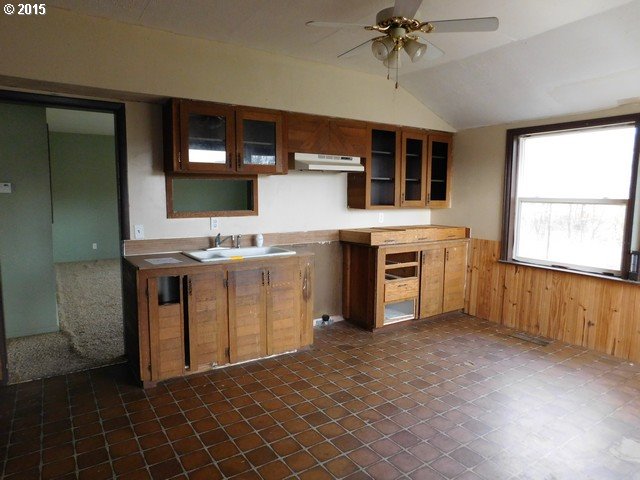82558 Hartle Road Pendleton, OR 97801 - Photo 5 of 17 a kitchen with stainless steel appliances granite countertop a stove a sink and a refrigerator