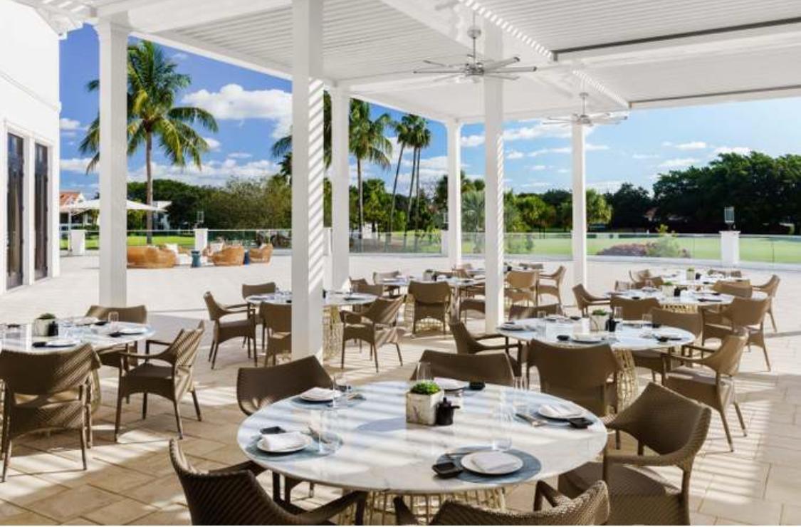 2299 Northwest 55th Street Boca Raton, FL 33496 - Photo 39 of 47 a view of an outdoor dining space with furniture