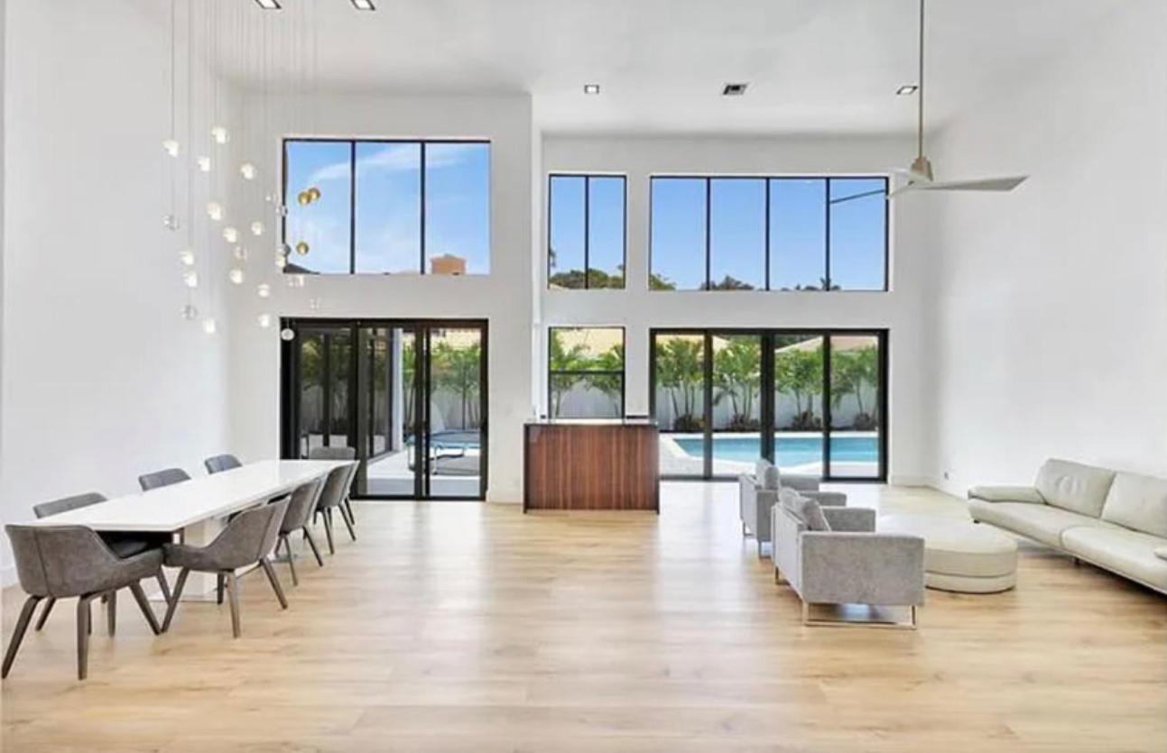2299 Northwest 55th Street Boca Raton, FL 33496 - Photo 8 of 47 a living room with furniture and large windows