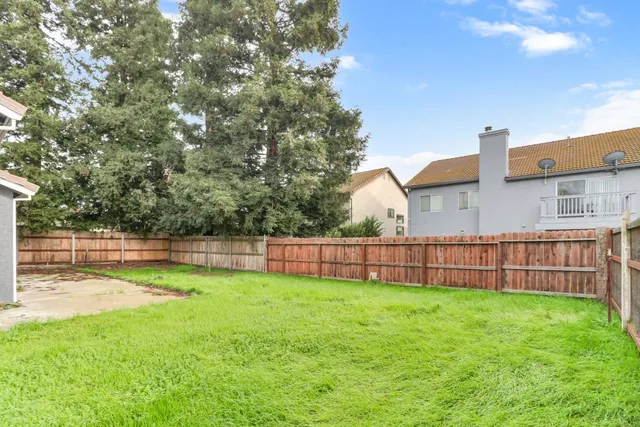 a view of a backyard with a small cabin