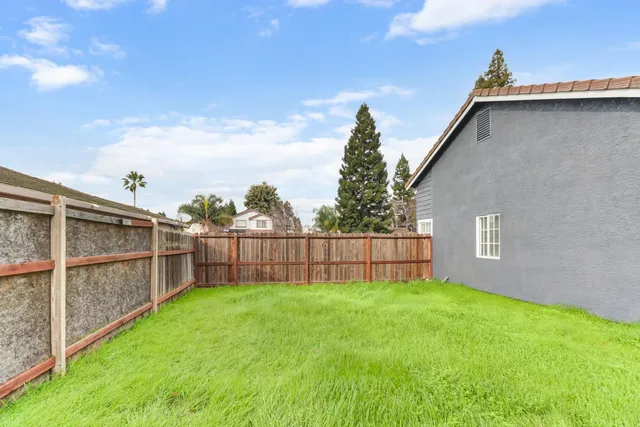 a view of a backyard with a cabin