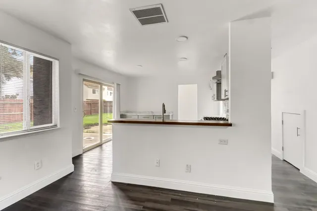 a view of cabinets and wooden floor