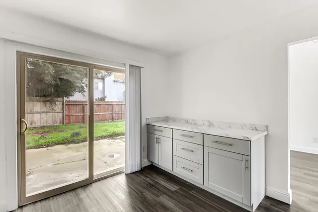 a view of cabinets and wooden floor