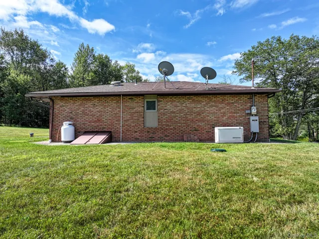 a backyard of a house with lots of green space