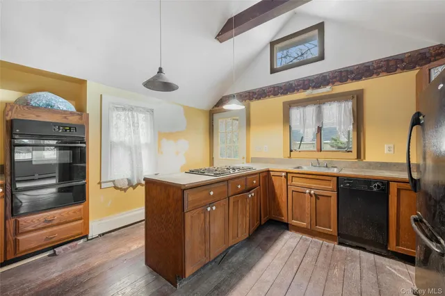 a kitchen with stainless steel appliances granite countertop a stove and a sink