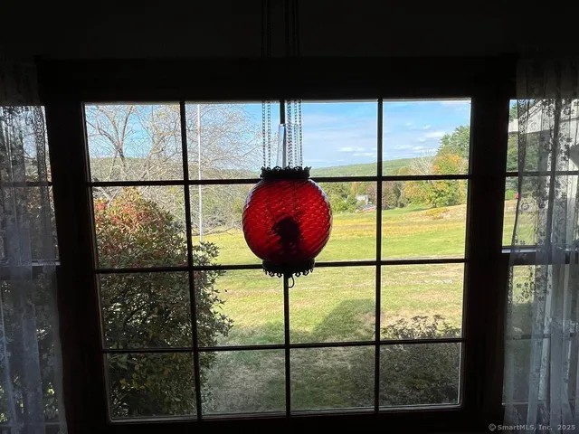 a view of room with wooden floor and window