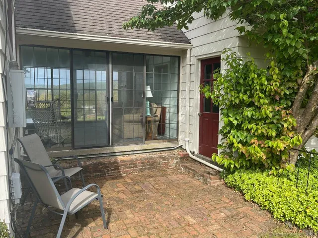 a view of backyard with seating space and garden