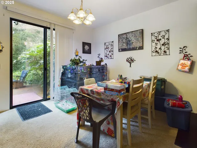a view of a dining room with furniture window and outside view