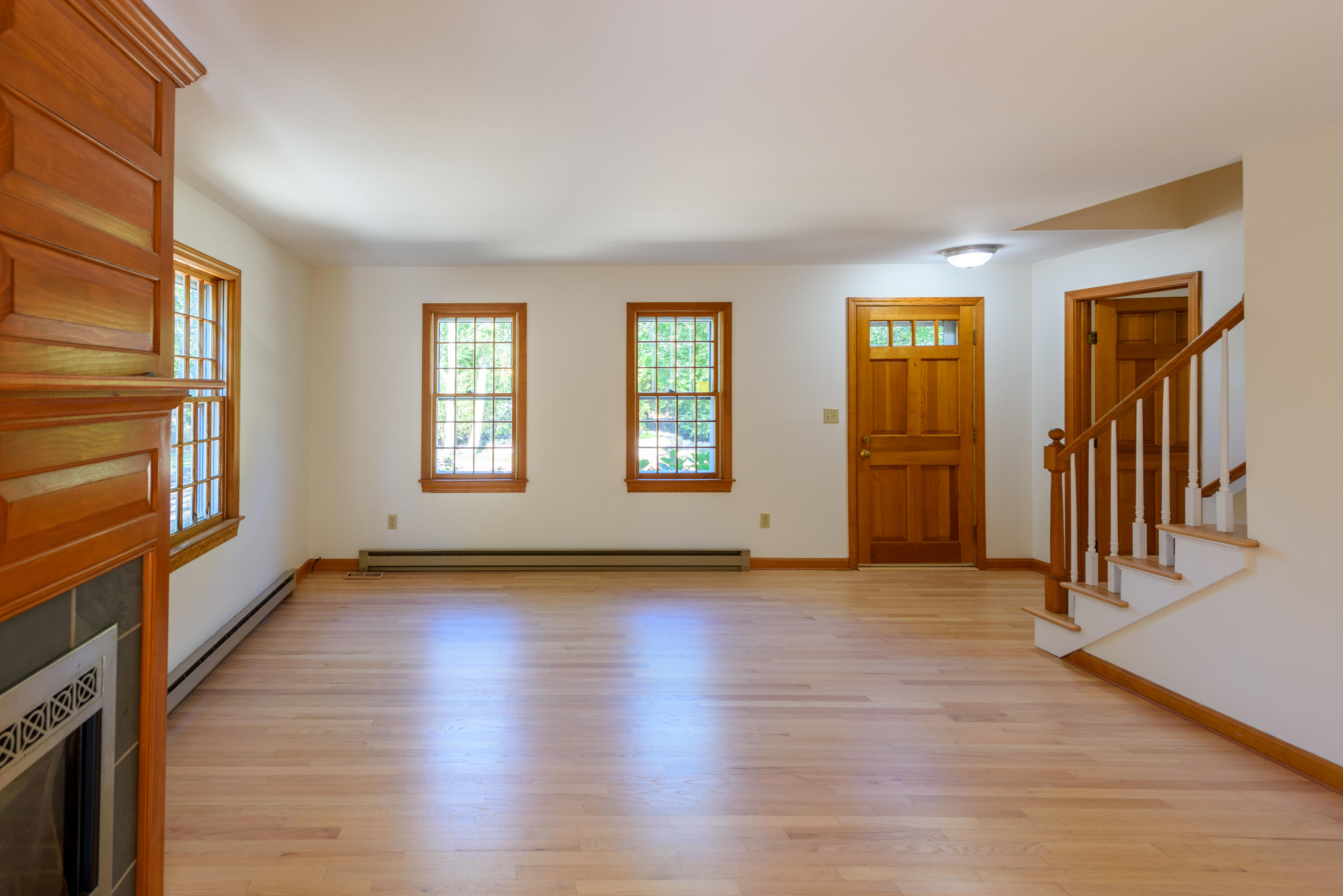 44 Marthas Road Edgartown, MA 02539 - Photo 14 of 30 an empty room with wooden floor and windows