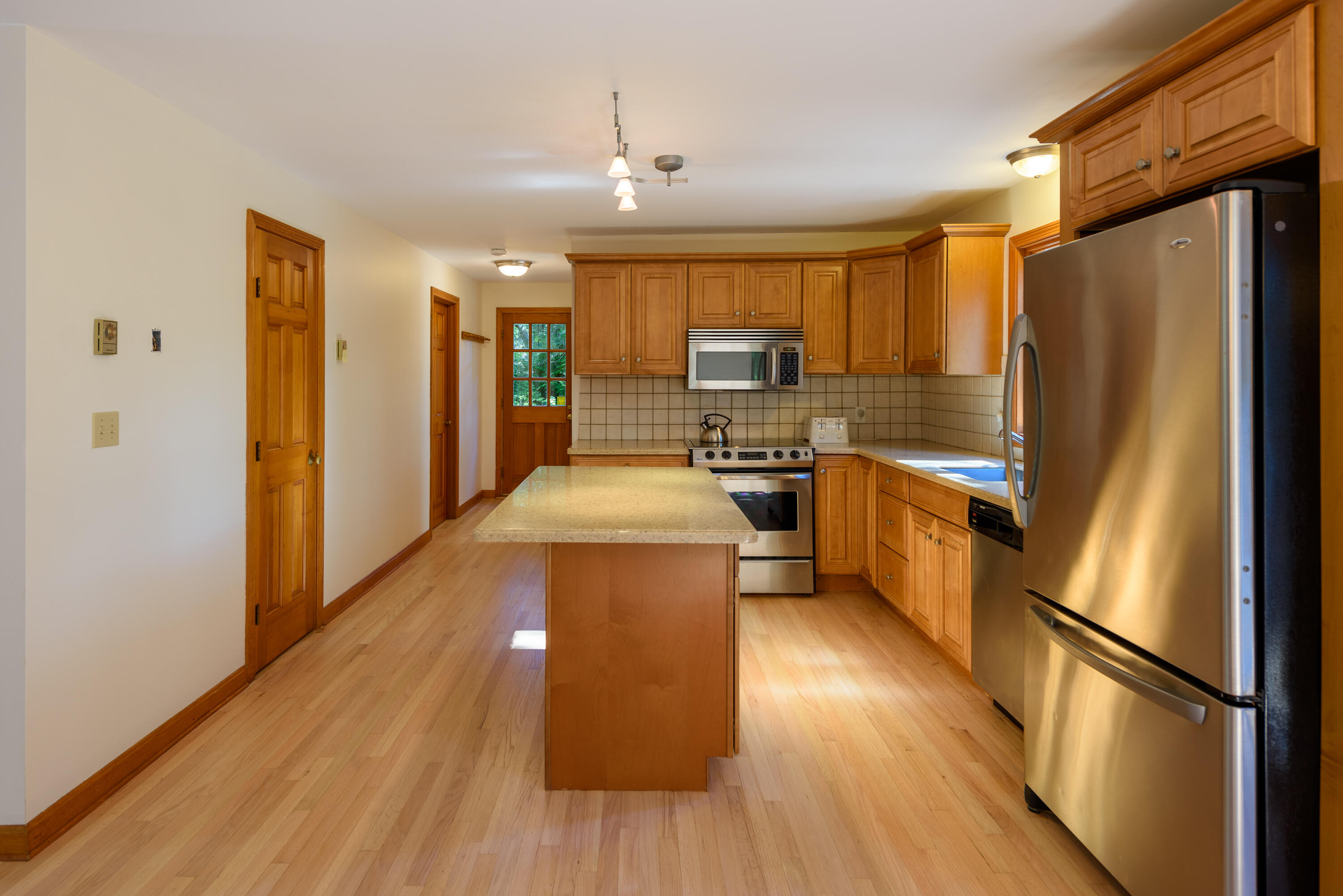 44 Marthas Road Edgartown, MA 02539 - Photo 18 of 30 a kitchen with stainless steel appliances a refrigerator a sink a stove and cabinets