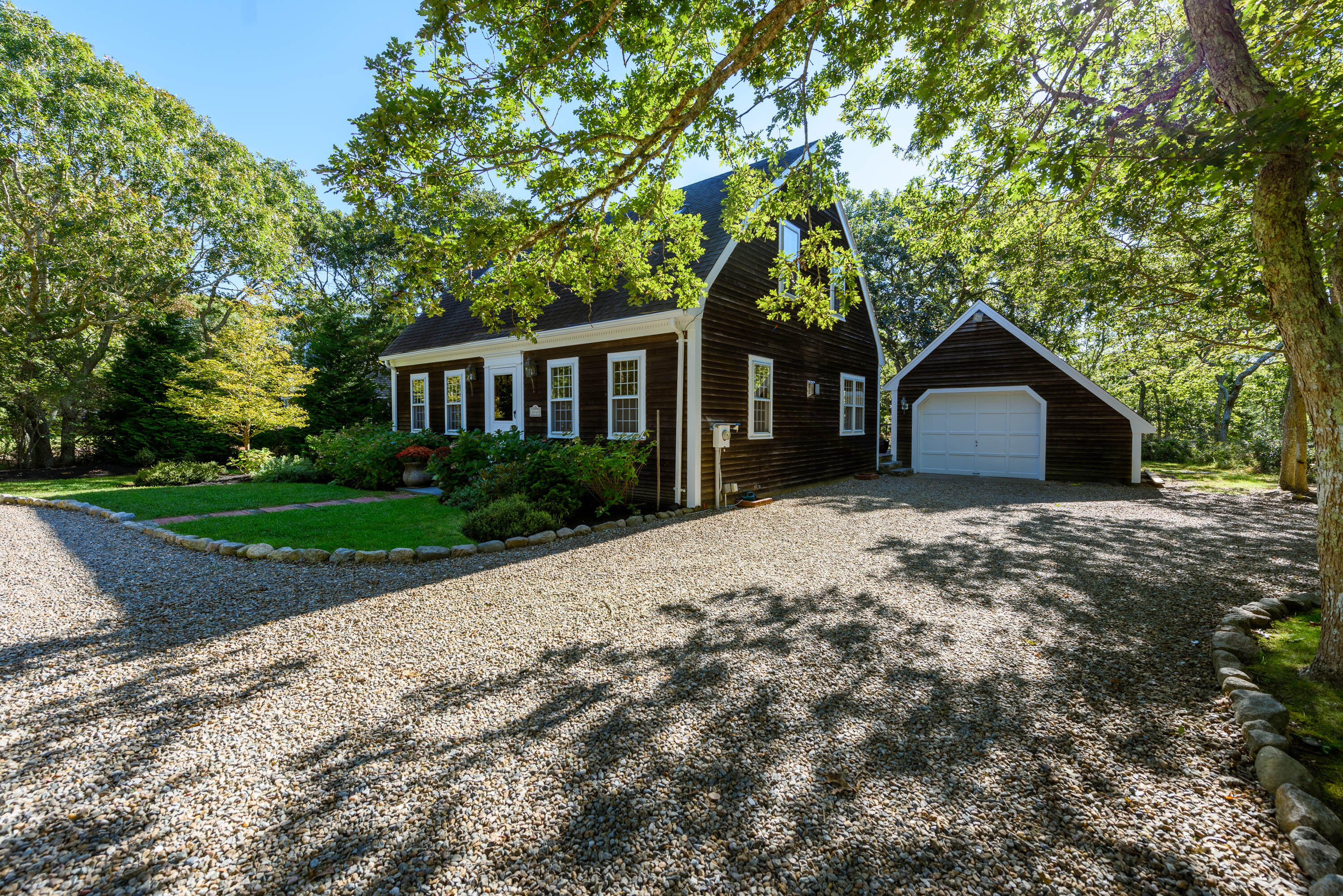 44 Marthas Road Edgartown, MA 02539 - Photo 2 of 30 a house with a tree in front of it