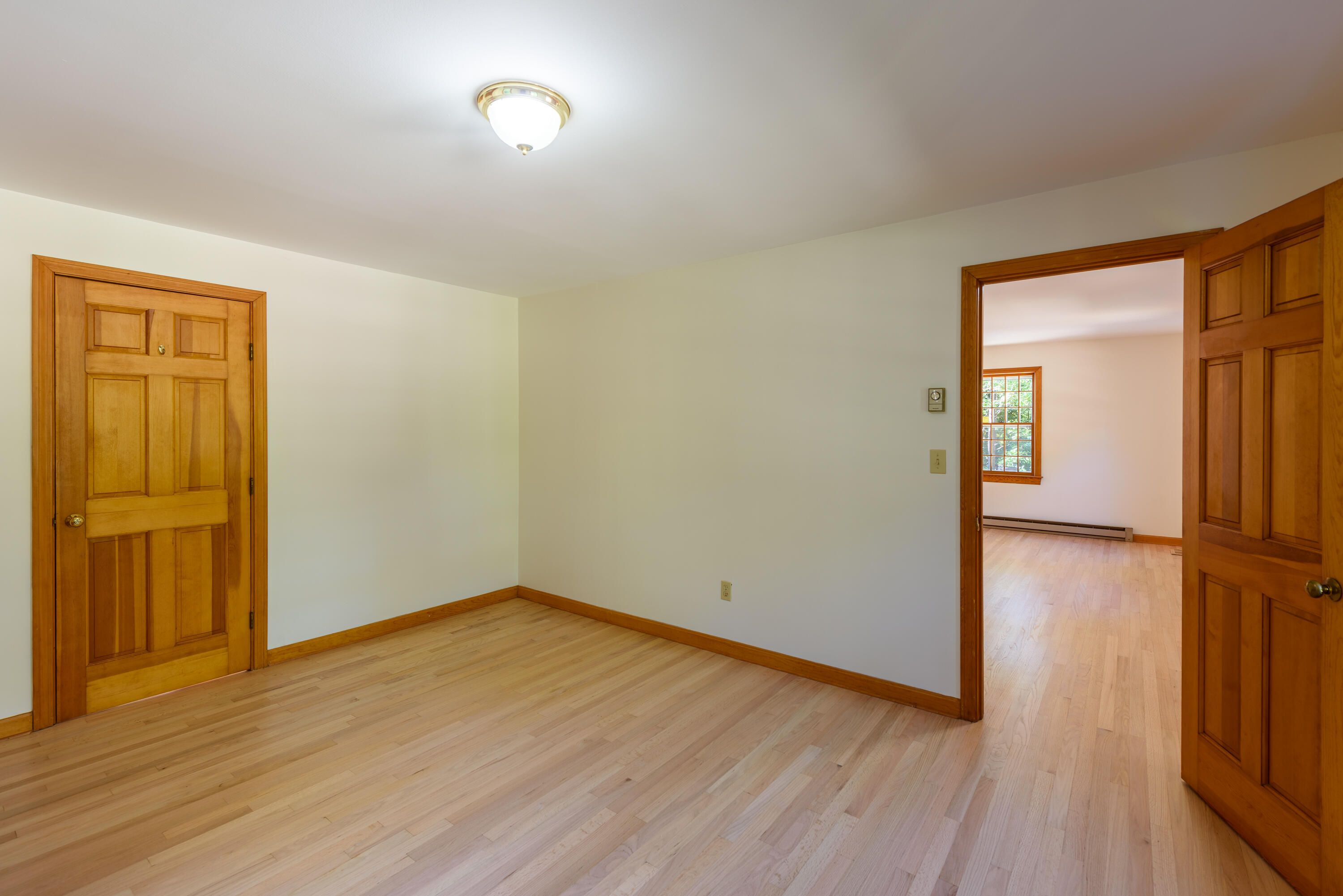 44 Marthas Road Edgartown, MA 02539 - Photo 23 of 30 an empty room with wooden floor and closet