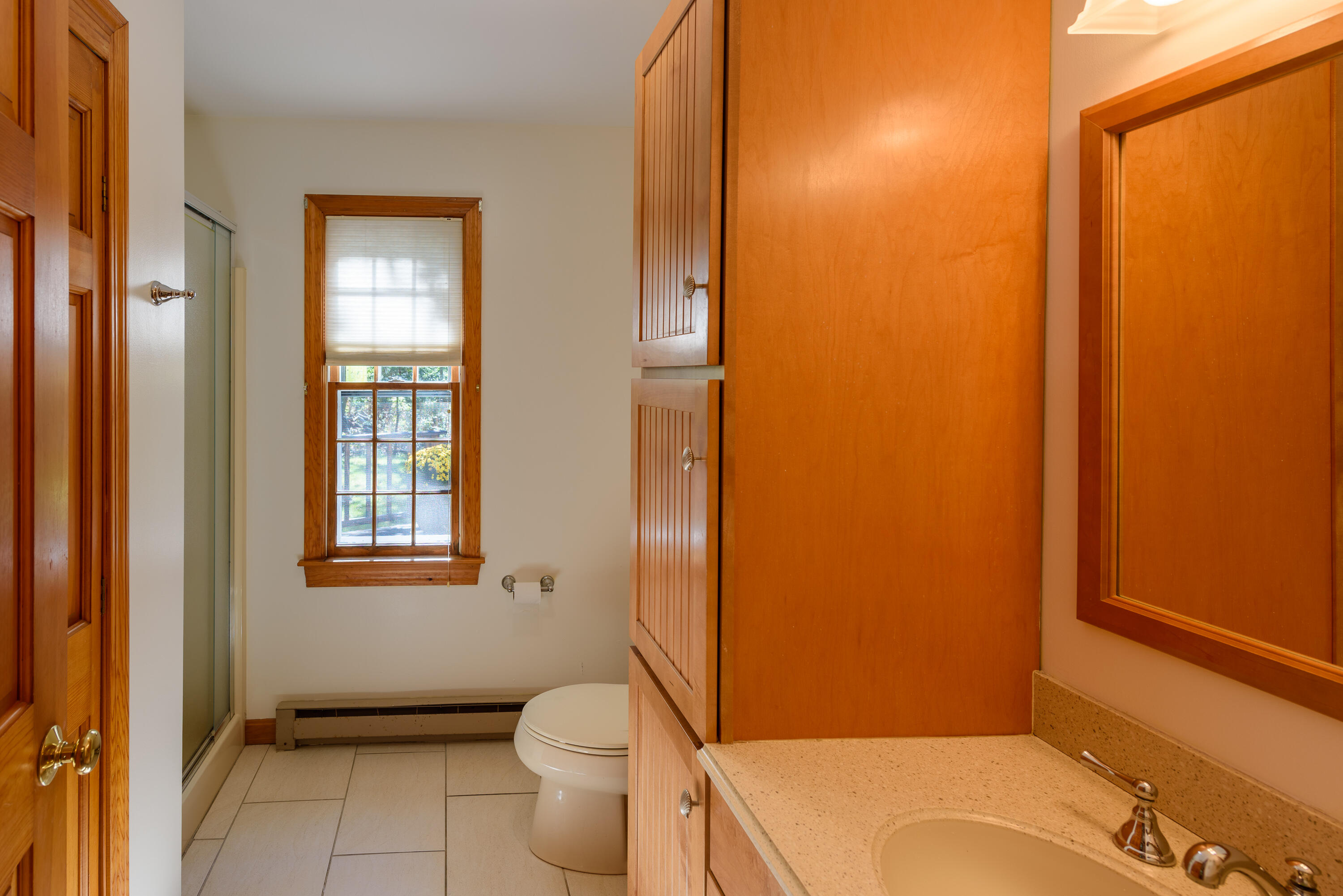 44 Marthas Road Edgartown, MA 02539 - Photo 24 of 30 a bathroom with a toilet and a shower curtain