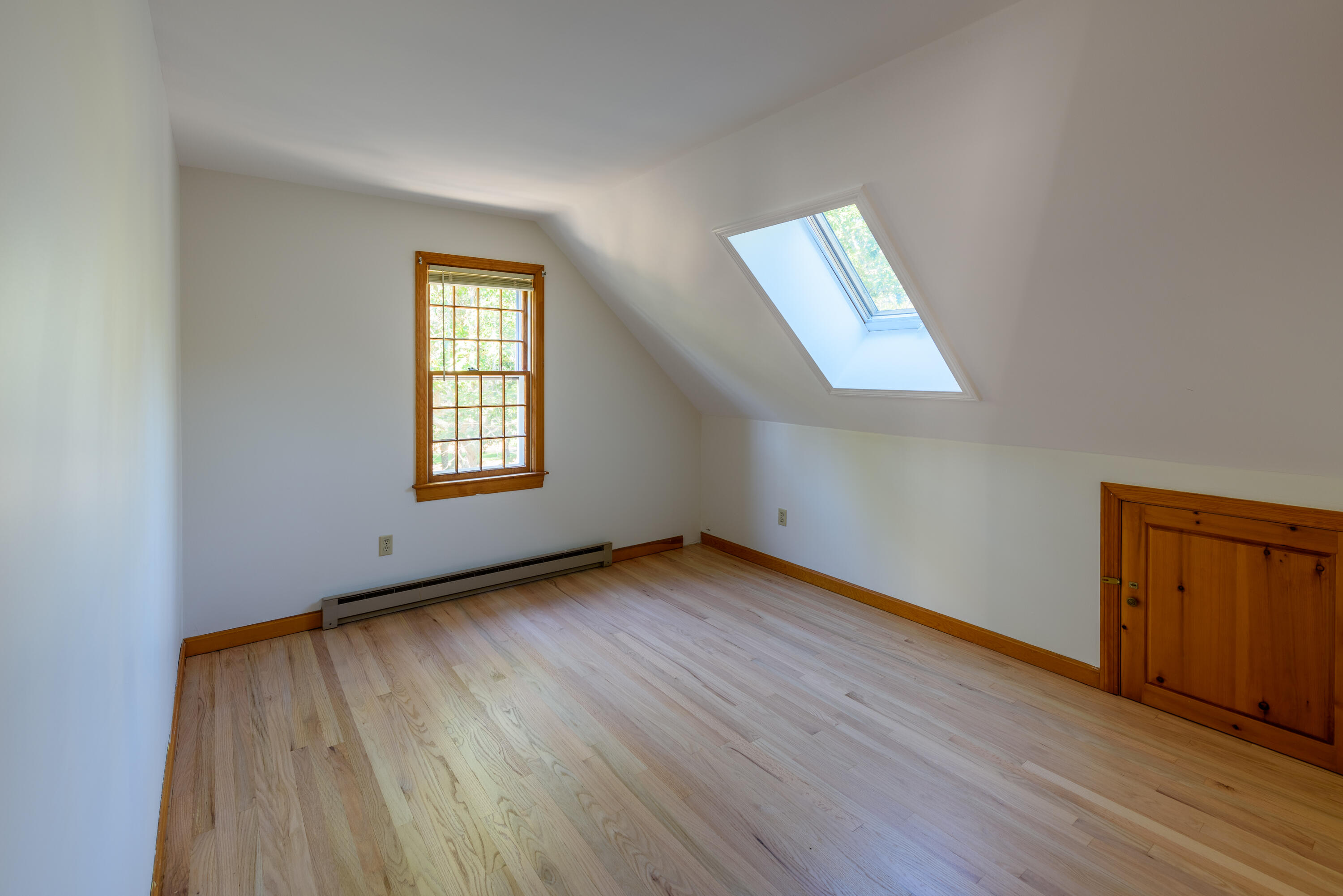 44 Marthas Road Edgartown, MA 02539 - Photo 25 of 30 an empty room with wooden floor and windows