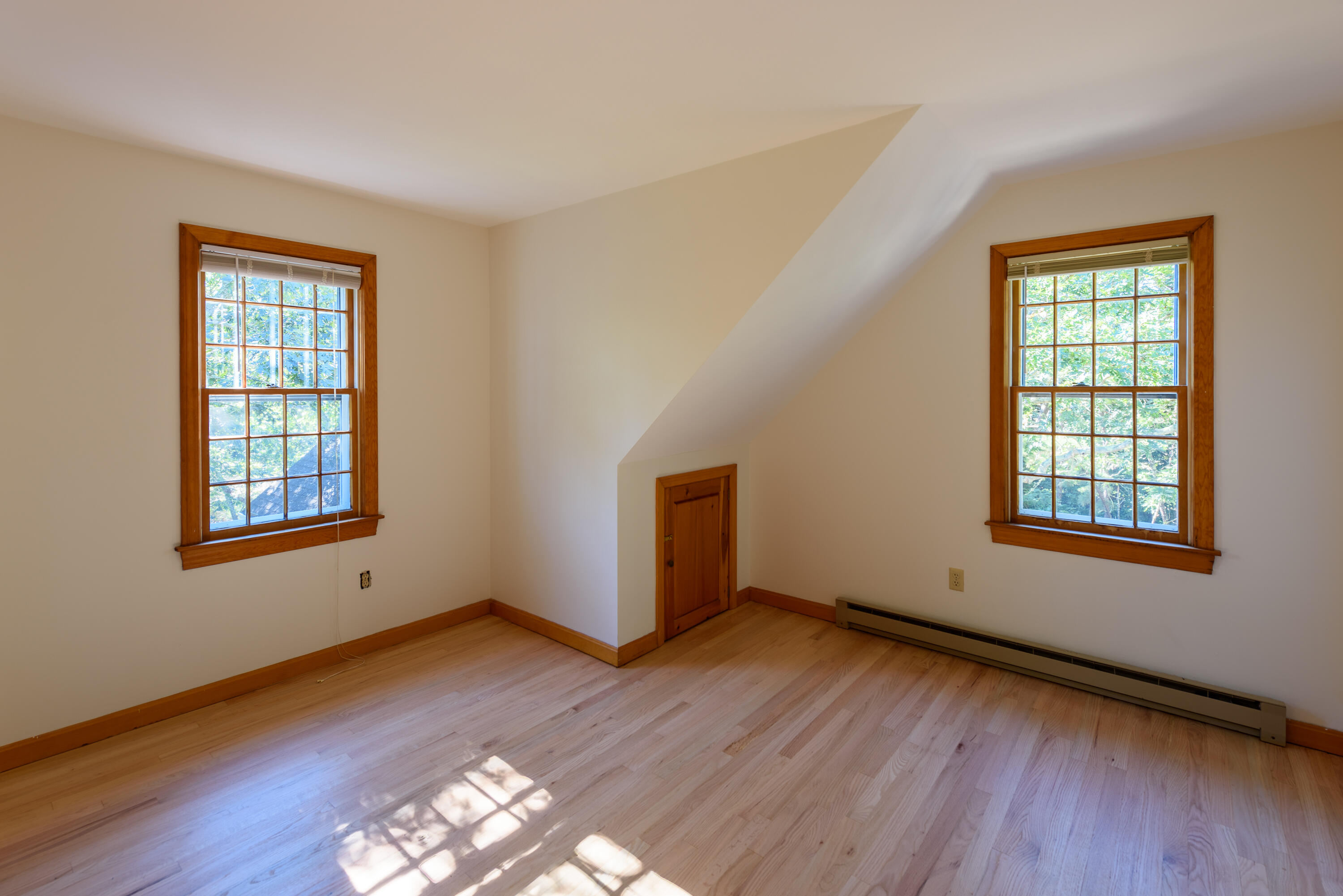 44 Marthas Road Edgartown, MA 02539 - Photo 26 of 30 an empty room with wooden floor and windows