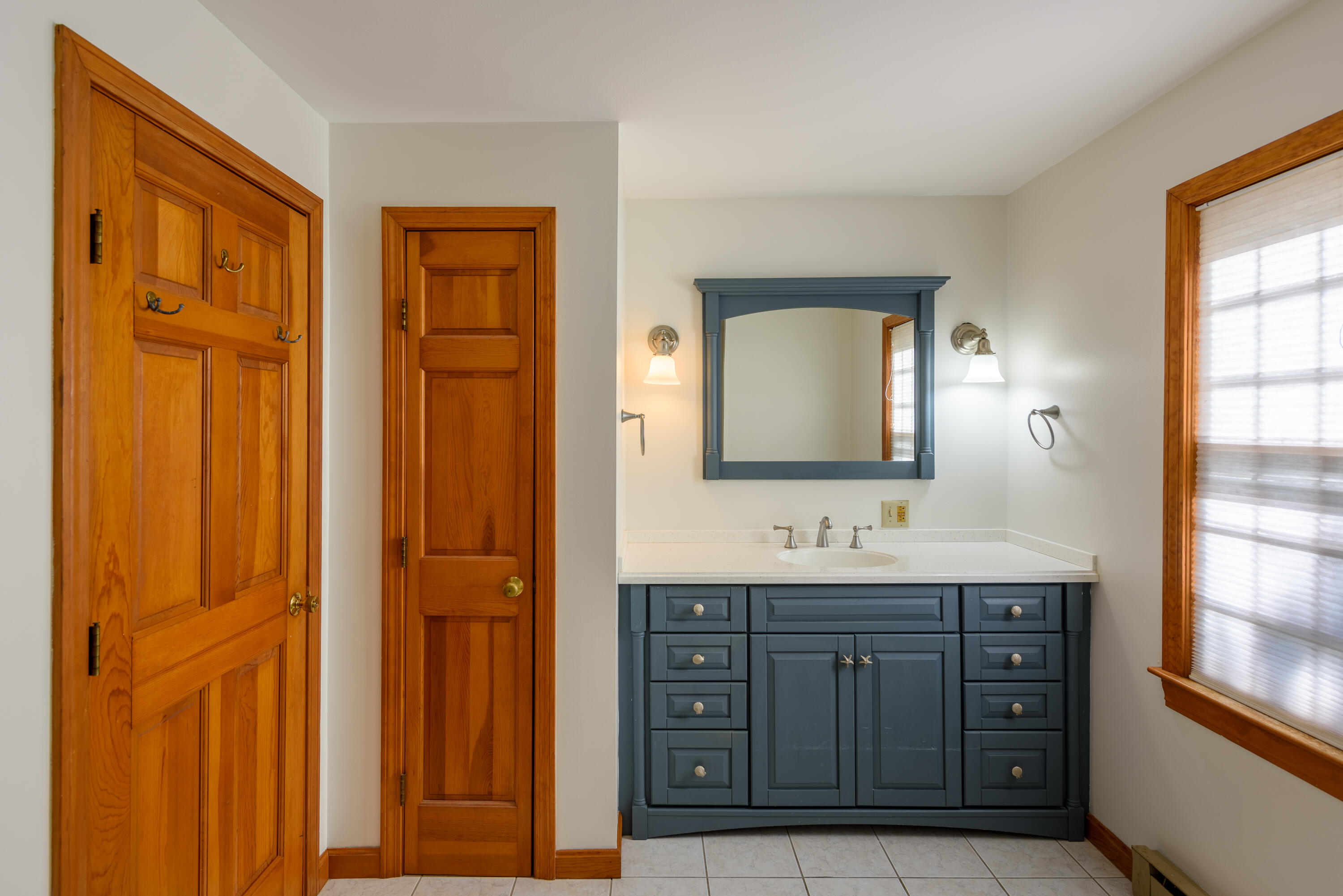 44 Marthas Road Edgartown, MA 02539 - Photo 28 of 30 a bathroom with a double vanity sink and a mirror