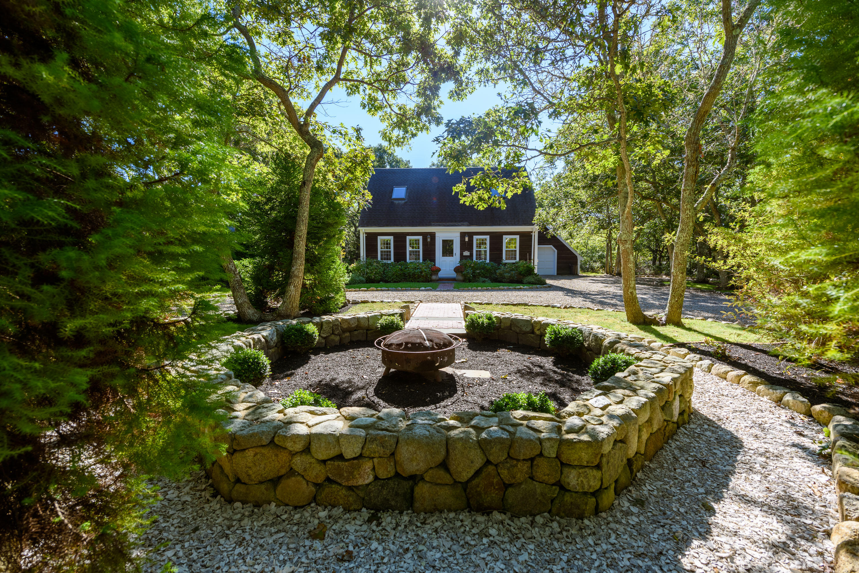 44 Marthas Road Edgartown, MA 02539 - Photo 6 of 30 a view of a house with backyard sitting area and garden