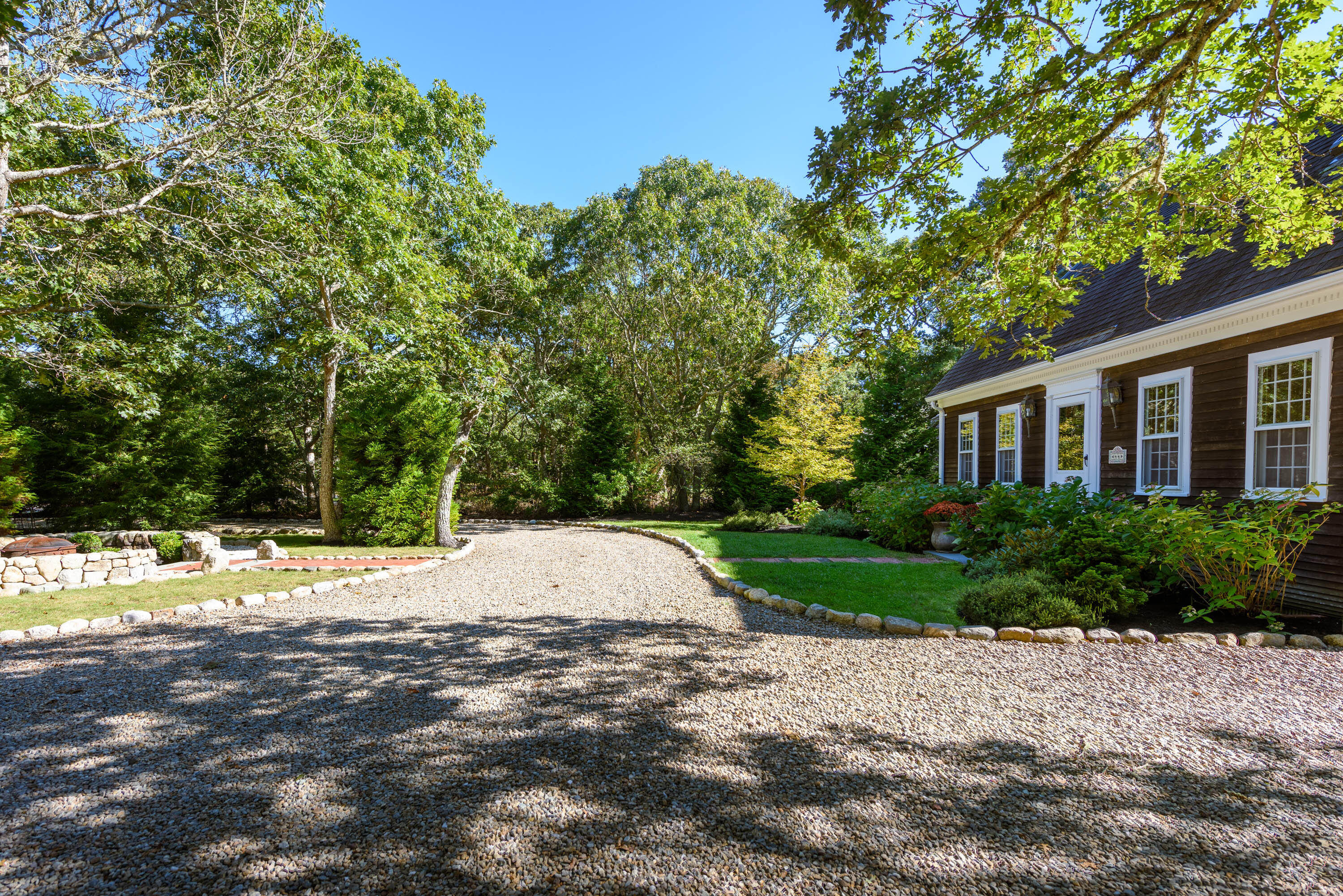 44 Marthas Road Edgartown, MA 02539 - Photo 7 of 30 a view of a house with a yard and street