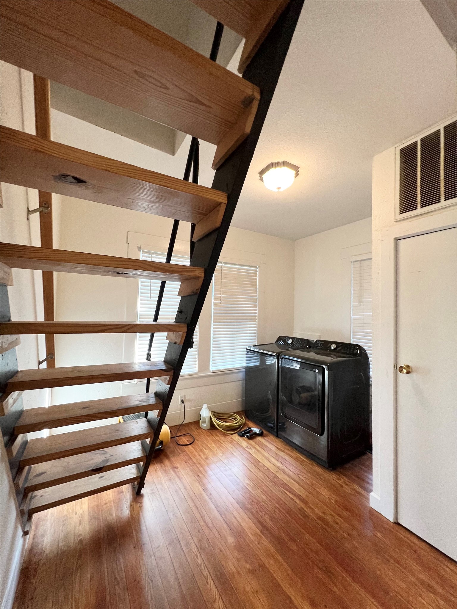 407 West 35th Street, Unit A Austin, TX 78705 - Photo 17 of 20 a view of entryway and hall with wooden floor