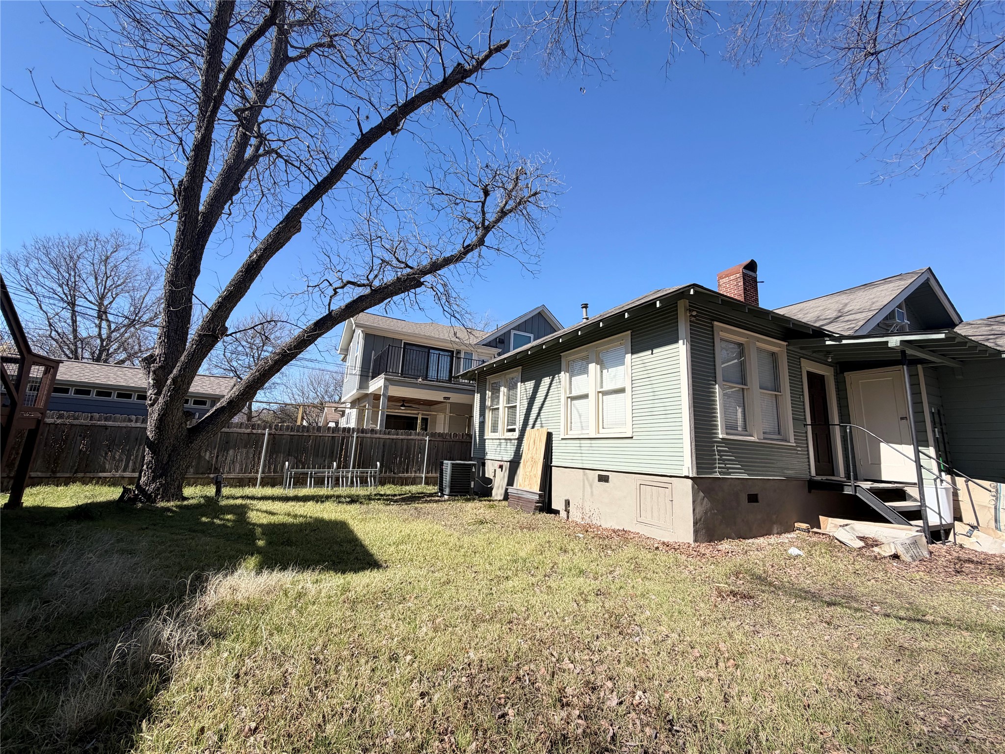 407 West 35th Street, Unit A Austin, TX 78705 - Photo 19 of 20 a view of a house with a yard and roof