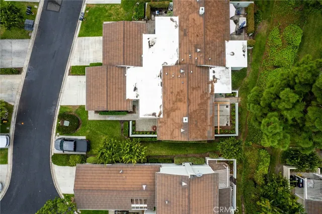 an aerial view of residential house with outdoor space and swimming pool