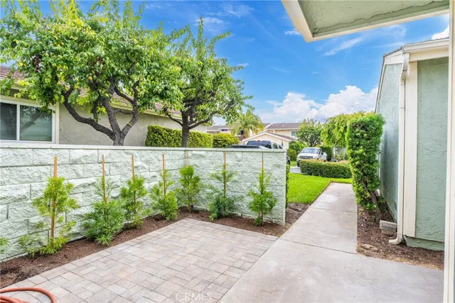 a view of entrance gate and garden