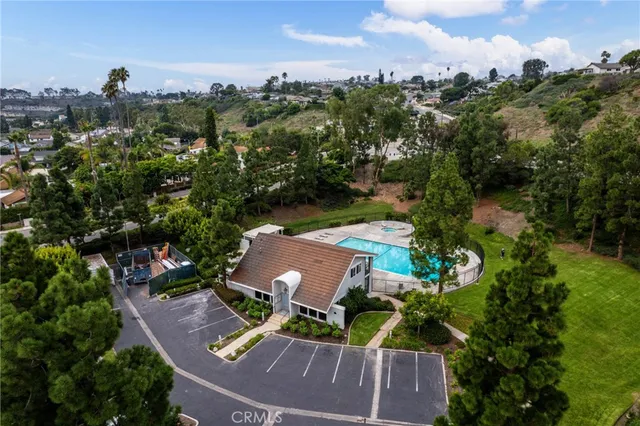 an aerial view of house with yard swimming pool and outdoor seating