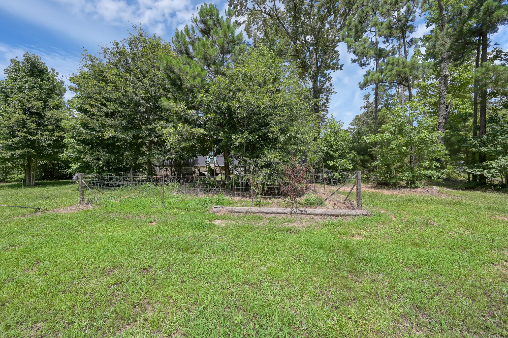 400 Raven Hill Road Oakhurst, TX 77359 - Photo 36 of 45 a view of a lake with a yard