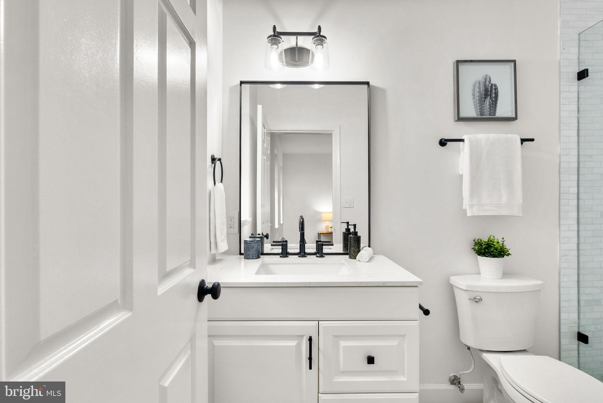 1843 Mintwood Place Northwest, Unit 204 Washington, DC 20009 - Photo 24 of 34 Sleek modern bathroom with elegant finishes.