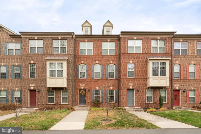 a front view of a building with a yard