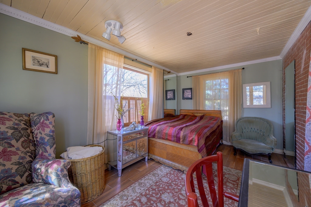 380 South Street Boston, MA 02130 - Photo 11 of 19 a living room with a bed furniture and a window
