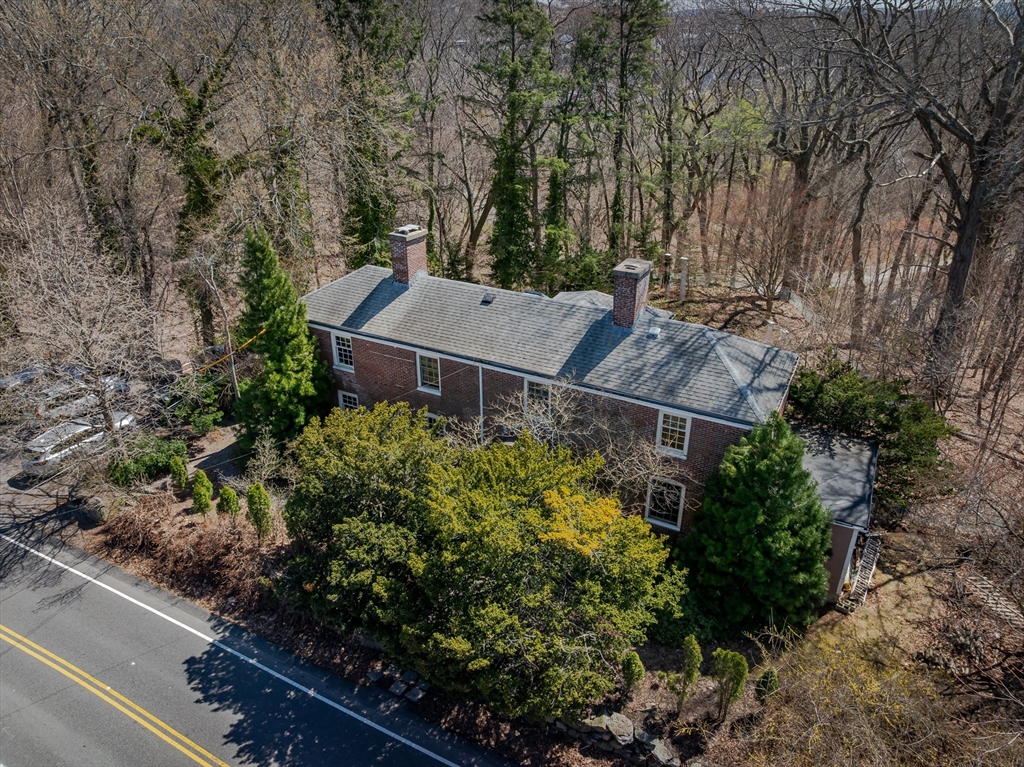 380 South Street Boston, MA 02130 - Photo 16 of 19 an aerial view of house with yard and trees in the background