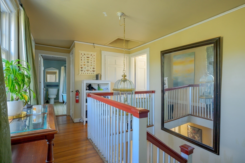 380 South Street Boston, MA 02130 - Photo 6 of 19 a view of a hallway with wooden floor and windows