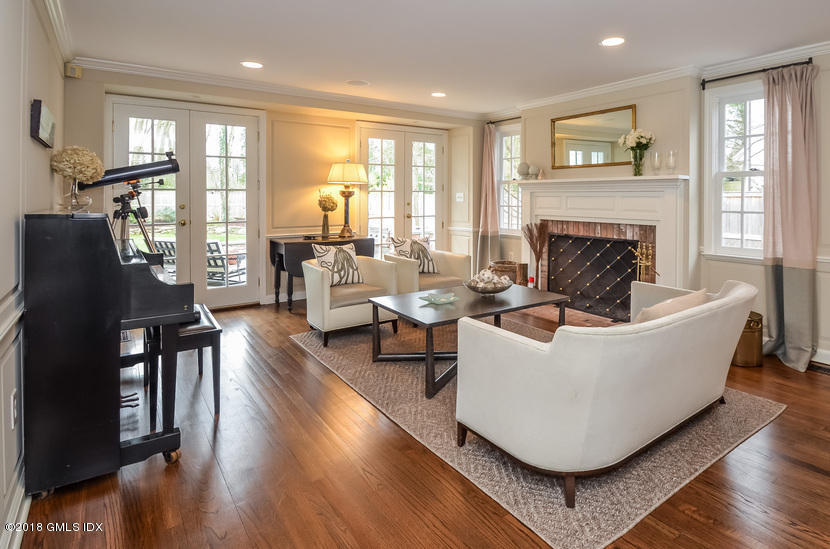 16 Willow Road Riverside, CT 06878 - Photo 12 of 30 a living room with couches fireplace and a large window