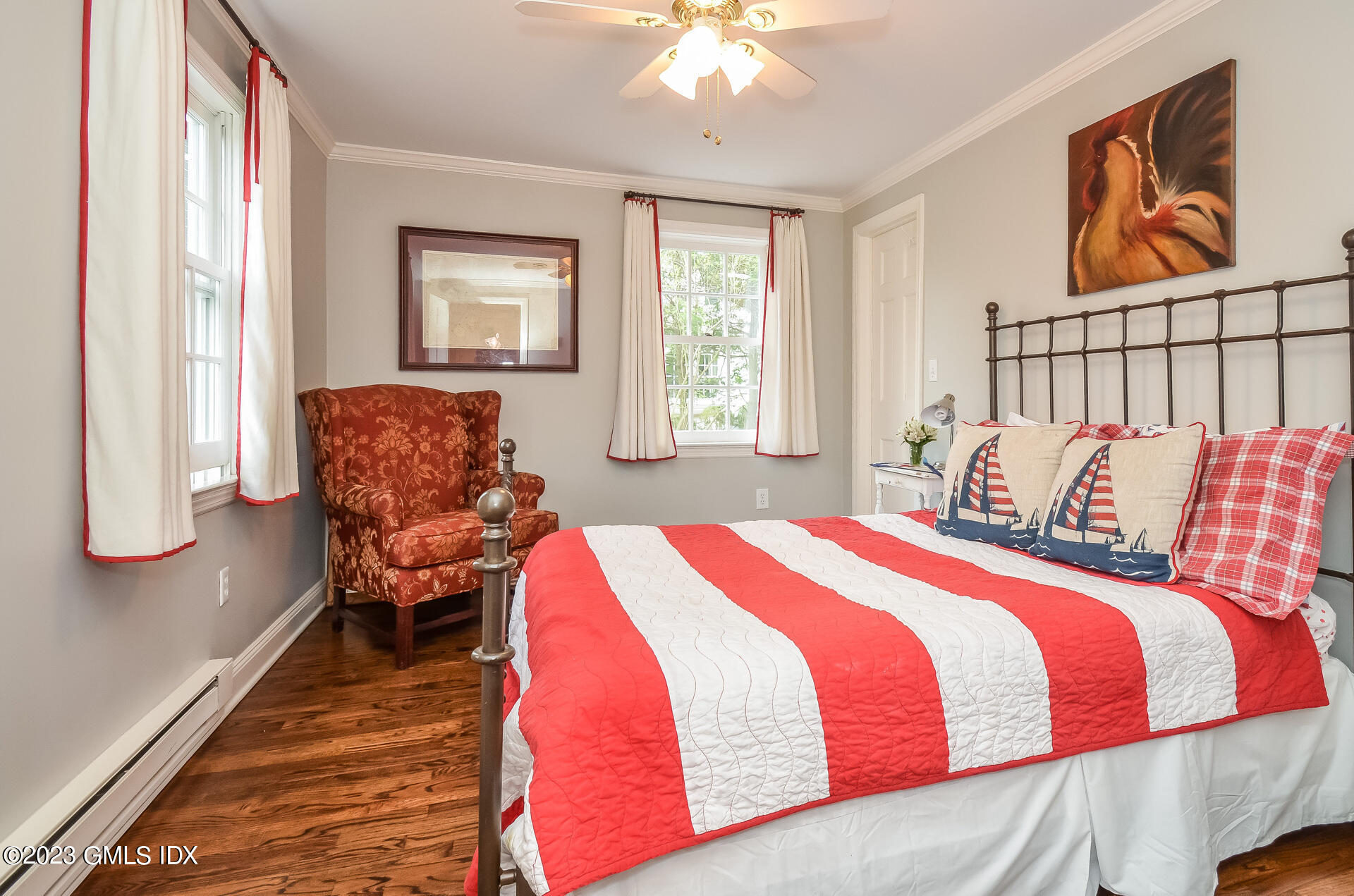 16 Willow Road Riverside, CT 06878 - Photo 17 of 30 a bedroom with a bed and wooden floor