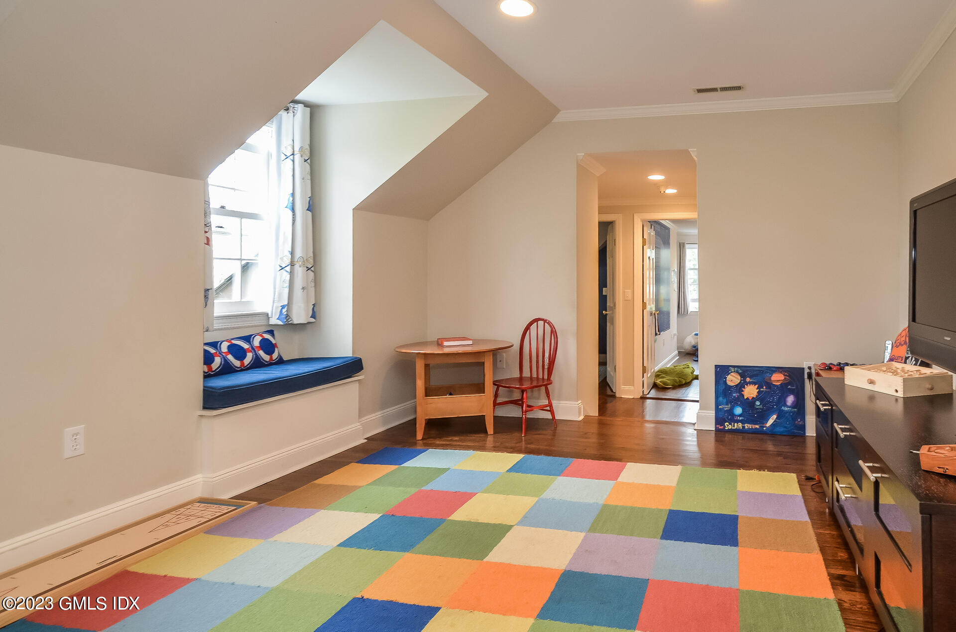 16 Willow Road Riverside, CT 06878 - Photo 22 of 30 a bedroom with a bed and wooden floor