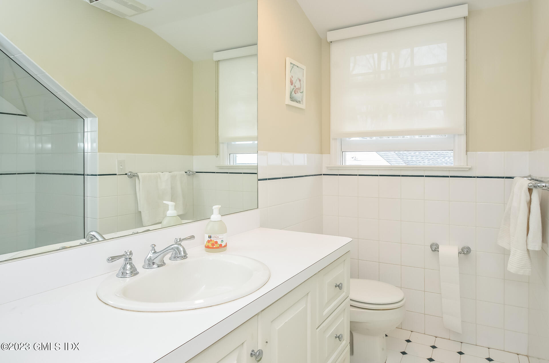 16 Willow Road Riverside, CT 06878 - Photo 27 of 30 a bathroom with a sink a toilet and a mirror