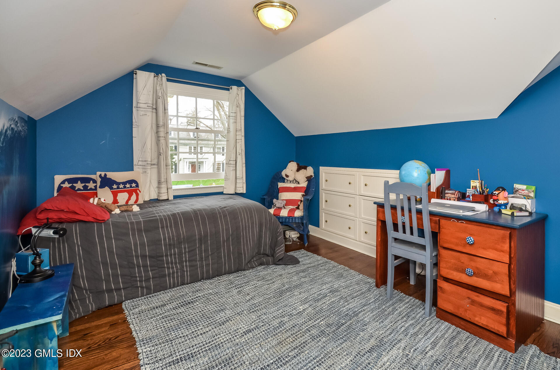 16 Willow Road Riverside, CT 06878 - Photo 28 of 30 a bedroom with a bed and wooden floor