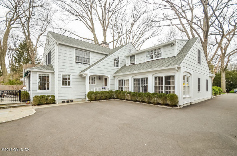 16 Willow Road Riverside, CT 06878 - Photo 4 of 30 a view of a white house with a large windows and large trees