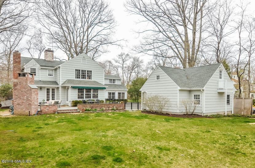 16 Willow Road Riverside, CT 06878 - Photo 5 of 30 a front view of a house with a yard