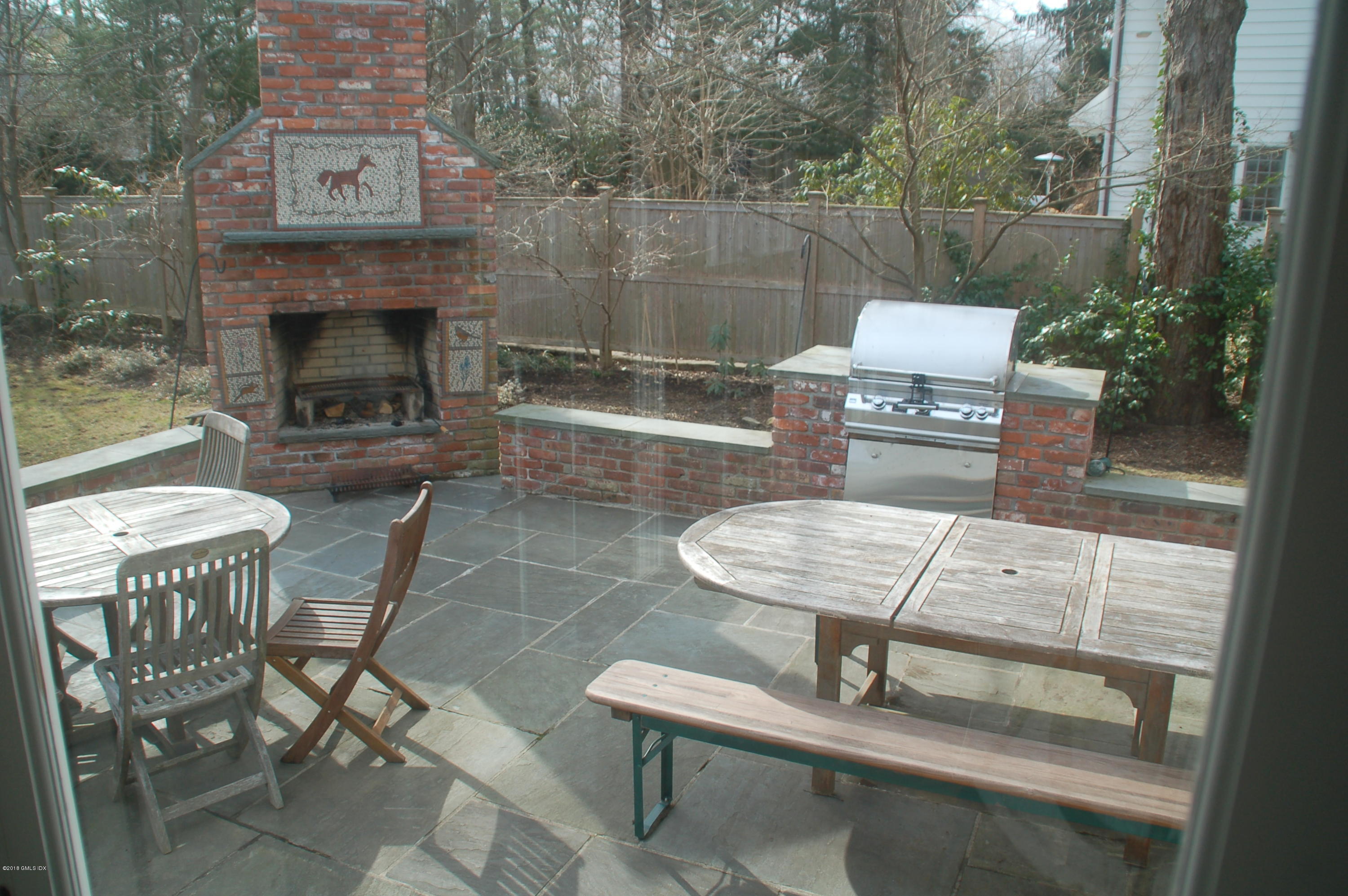 16 Willow Road Riverside, CT 06878 - Photo 6 of 30 a balcony with table and chairs