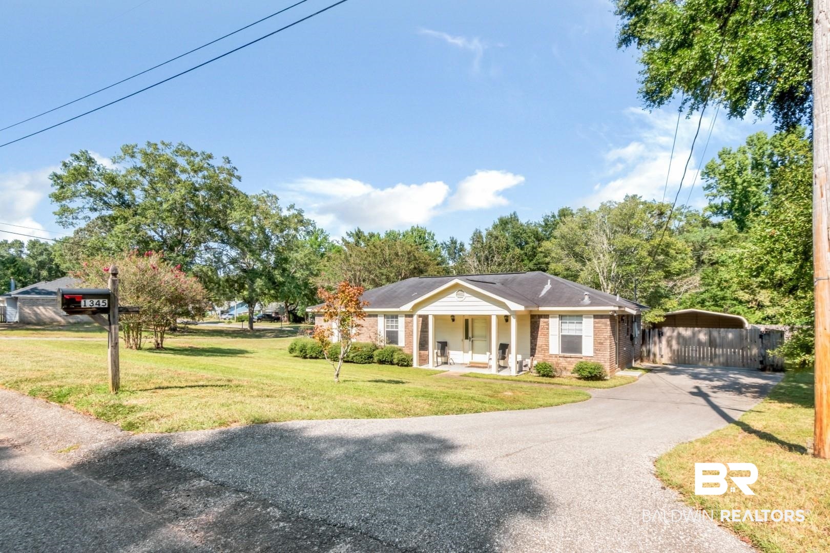 1345 Camden Court Mobile, AL 36695 - Photo 27 of 31 View of front facade with covered porch, driveway, brick siding, and a carport